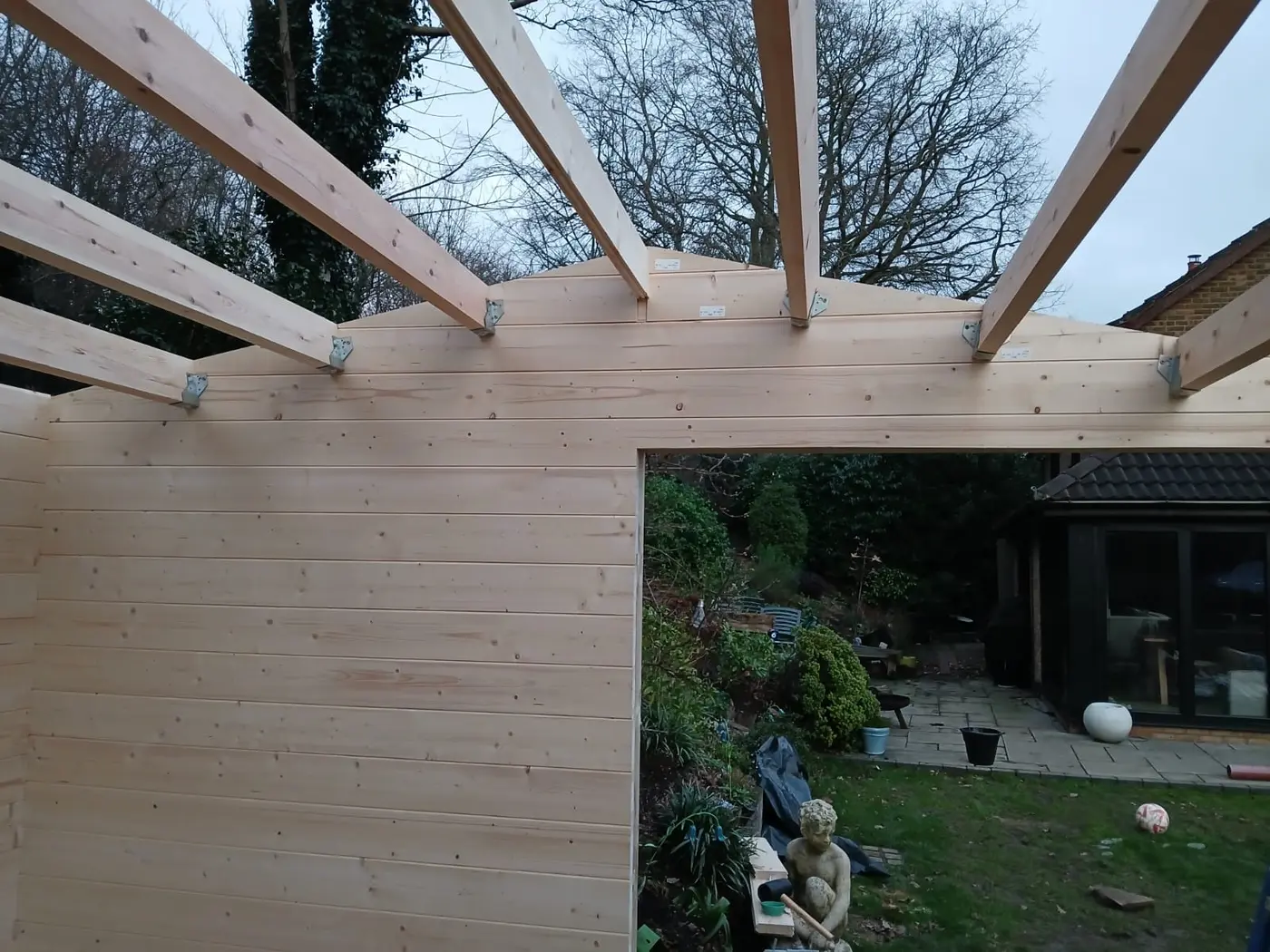 Careful timber roof construction on a garden room